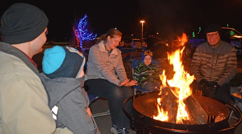 Penholders kept warm around the fire pit during last year&#8217;s Community Christmas event in Penhold at the multiplex.