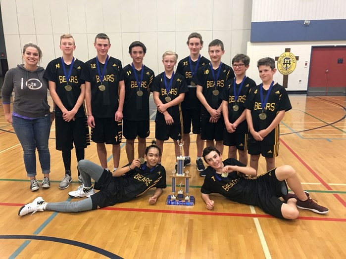 The CENAA junior high boys&#8217; volleyball champions from St. Marguerite Bourgeoys Catholic School in Innisfail pose with their gold medals and trophy, along with head