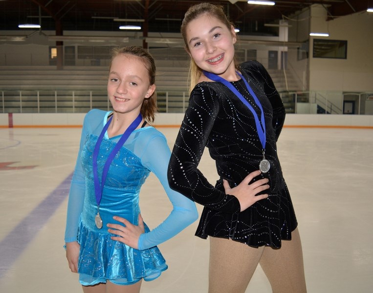 Innisfail skaters Claira Sinclair, left, and Devan Korsiger proudly pose with their silver medals they recently won during the Edmonton STARSkate Invitational Nov. 24 to 26