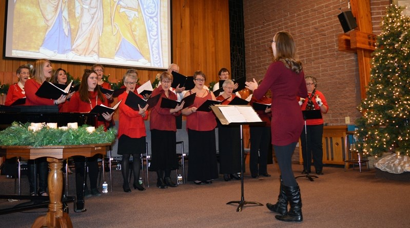 Members of the Innisfail United Church choir share Christmas music during their annual Candles, Carols and Cookies Christmas event on Sunday (Dec. 17) evening.