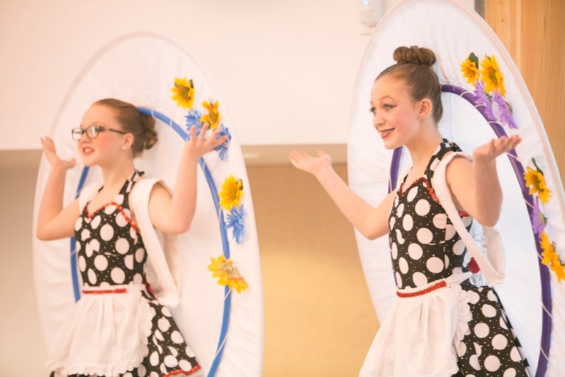 Kaylyn Bates, left, and Abby Jackson perform at the start of the event.