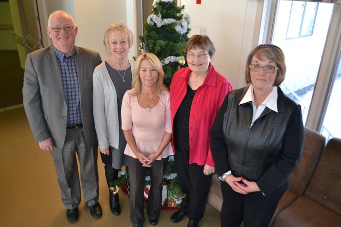 The new manager of Autumn Glen was officially introduced on Dec. 17. Barb Lewis (centre) is the new manager. Denis Beesley, president and CEO of The Bethany Group, is at far