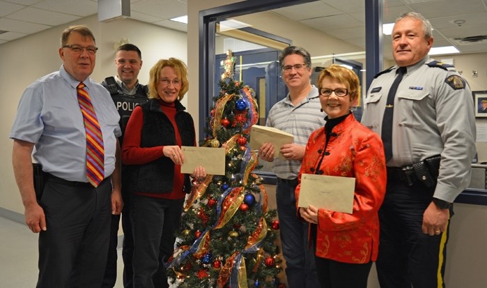 The 22nd annual Innisfail Charity Checkstop raised close to $12,000 in cash donations and 900 pounds of food in non-perishable food donations, for local charities. The event