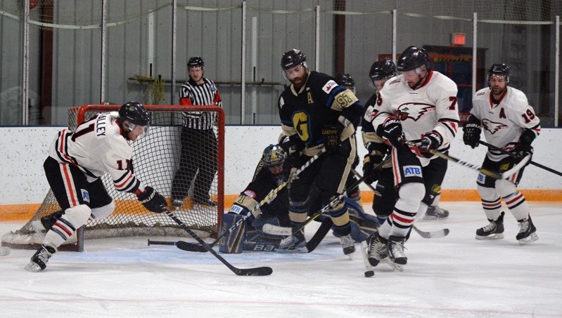 The Innisfail Eagles battle in front of the net during a game against the Lacombe Generals on Jan. 7 at the Arena. The Birds lost the close contest in a 5-4 shootout.