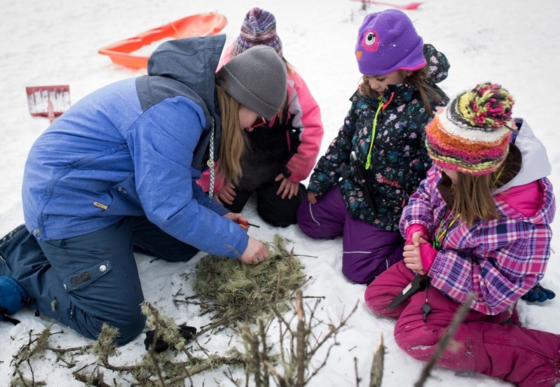 Members of the Innisfail Falcons junior forest wardens learn about fire safety during their winter camp in March of 2017.