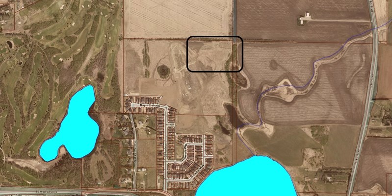 Since 2001 Red Deer Catholic Schools has identified plans for a new school in north Innisfail at an 11.1-acre site, marked in top centre of the aerial photograph, and located 