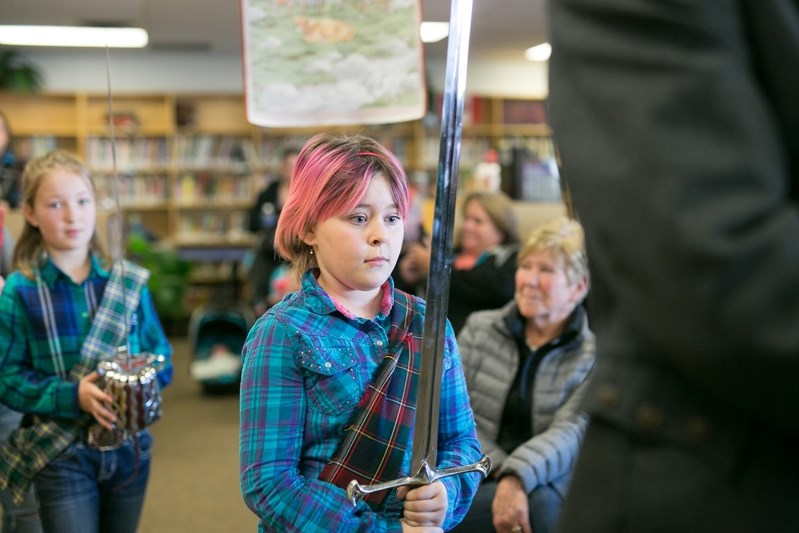 Grade 4 student Erica-Rae LeBlanc carries a sword during the piping in of the haggis for the 21st annual Burns In Bowden event on Jan. 26 at Bowden Grandview School.