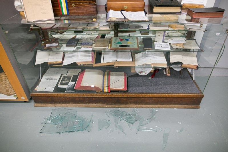 Broken glass in front of a smashed display cabinet at the Bowden Pioneer Museum on Feb. 1.