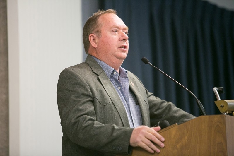 Red Deer County mayor Jim Wood addresses the crowd at the Rural Crime Town Hall meeting in Innisfail on Jan. 27. He told the crowd the rural municipality will be launching