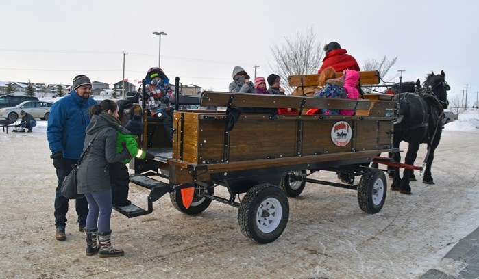 Penhold mayor Mike Yargeau, left, was out helping with Family Day festivities at the Penhold Regional Multiplex on Feb. 18.