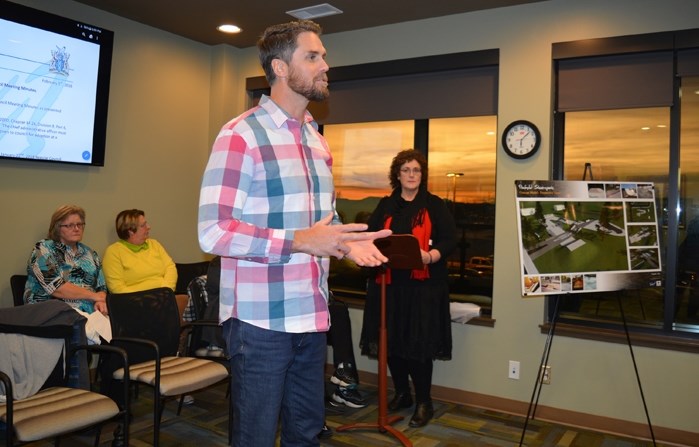 Trevor Morgan of New Line Skateparks Inc., and Brenda Mahoney, chair of the Penhold skatepark committee, back, speak to council during a presentation at a council meeting