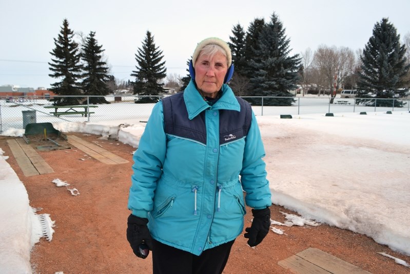 Myrna Kissick, president of the Innisfail Horseshoe Club, at the horseshoe pits last week. Behind the facility is the location chosen two years ago for the new skatepark. Her 