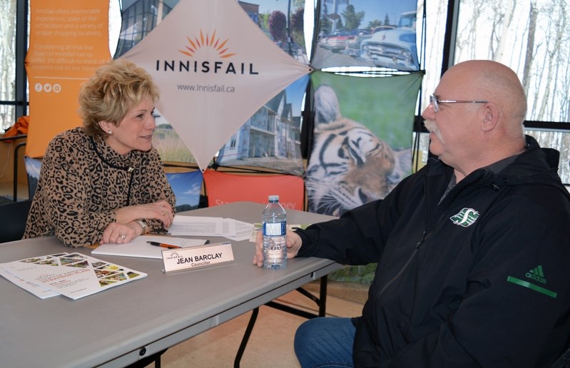 Coun. Jean Barclay talks with a local resident during the town&#8217;s first-ever speed dating with council event at the Innsifail Library/ Learning Centre on March 3.