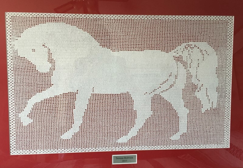 A photo of a framed crocheted horse that raised $4,000 during a silent auction in Red Deer for the 2019 Canada Winter Games. The artwork was created by Teresa Rolvink of