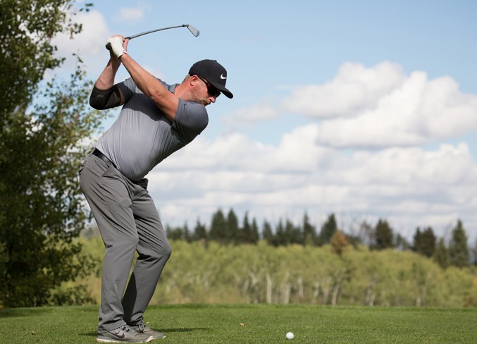 Matthew Stafford tees off from the first hole.