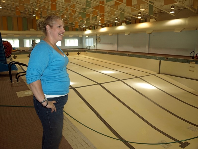 Dawn Murray, acting aquatic supervisor at the Innisfail Aquatic Centre, stands over the facility&#8217;s empty pool that is undergoing its first major upgrade since opening