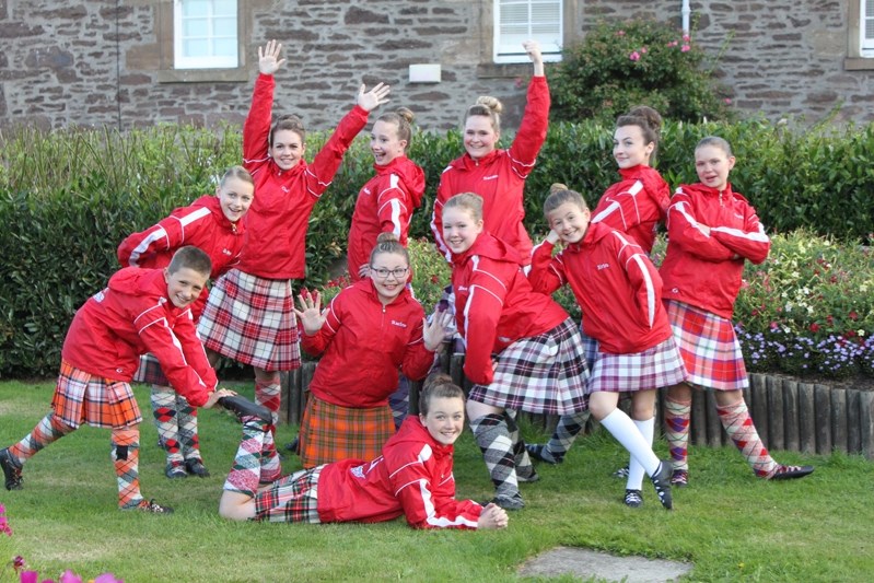 The group of 11 Central Alberta dancers who competed in Scotland from August 6 to 21. Kayla Ainscoughis lying on ground while Madison Puttee is in back between two girls with 