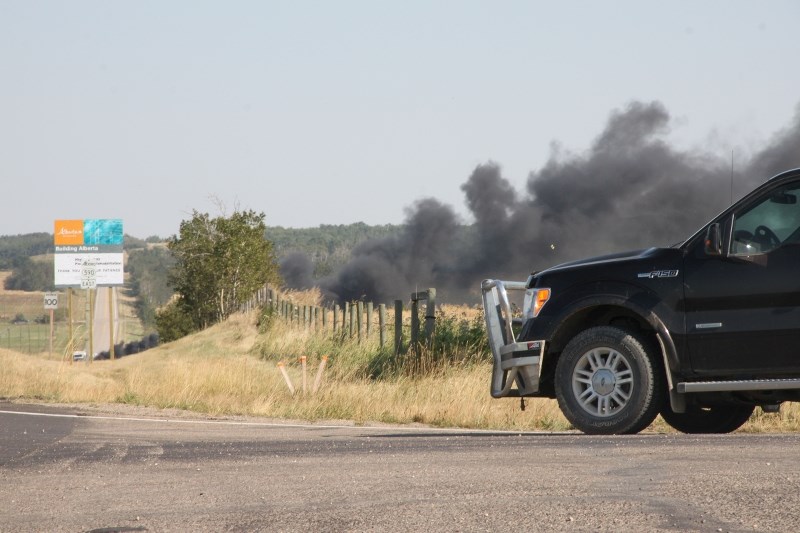 Thick black smoke rose from a vehicle fire that ignited on Highway 590 on Sept. 13.