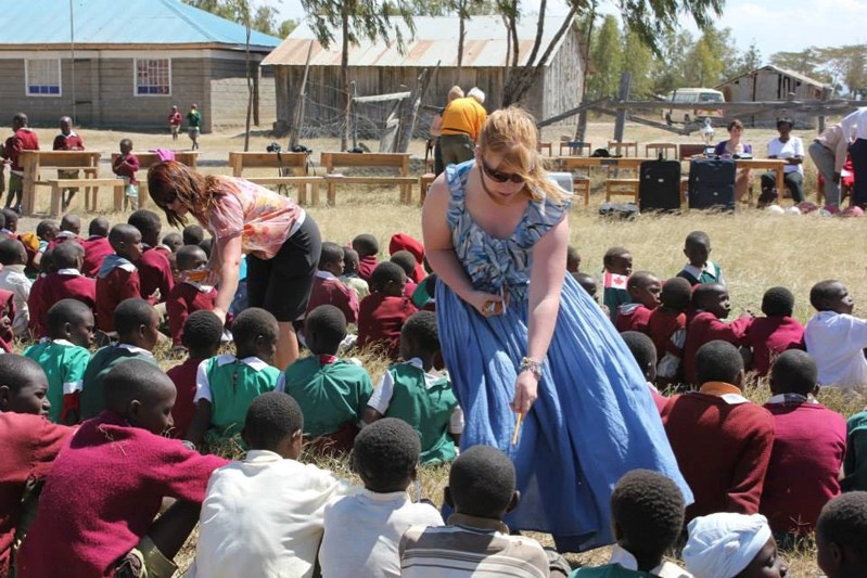 Innisfail teachers distribute pencils to Kenyan students during their July trip with A Better World.