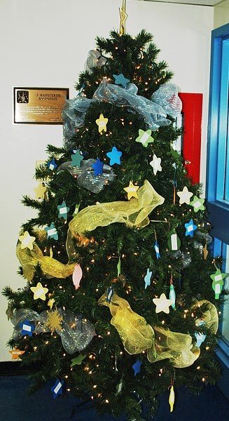 Advent gift giving tree adorns the front entrance to St. Marguerite Bourgeoys School on Dec. 11.