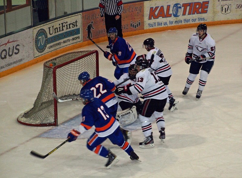 The Okotoks Drillers buzz around the Innisfail Eagles net in second period action during their road game in Innisfail on Dec. 11. The Eagles won the game 7 &#8211; 3.