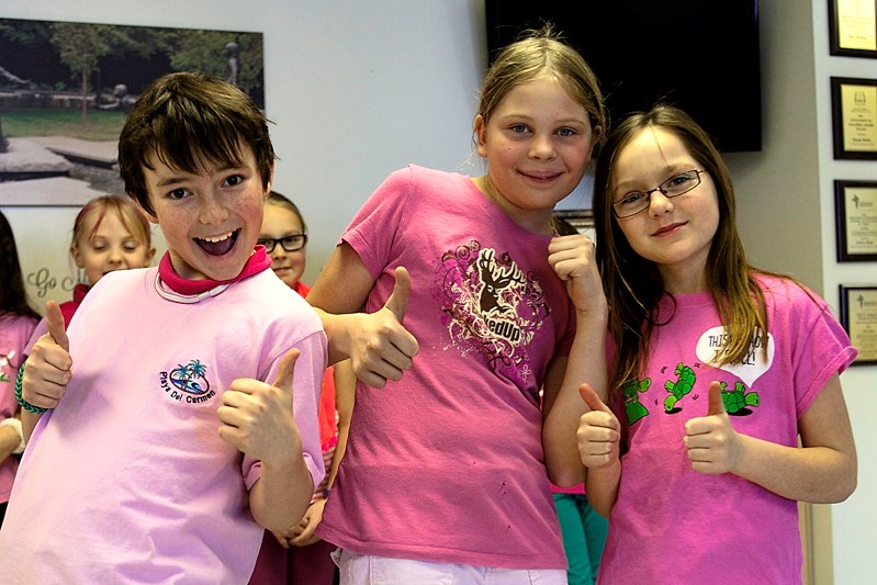 St. Marguerite Bourgeoys school students give National Pink Shirt Day the thumbs up on Feb. 26.