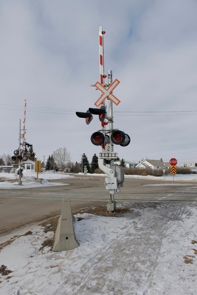 The 49 Avenue CP Railroad crossing waits for rail traffic