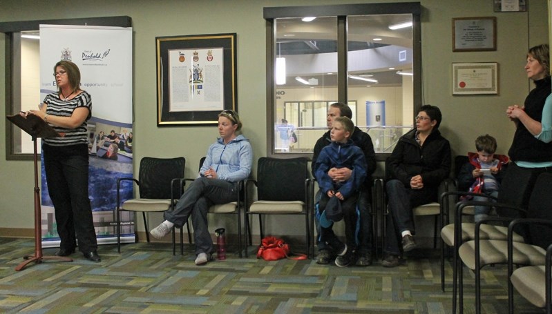 April Jones (far left) presents the Penhold Skatepark committee recommendations and requests to Penhold council on April 14. From left to right, Robyn Darling, James, Evan