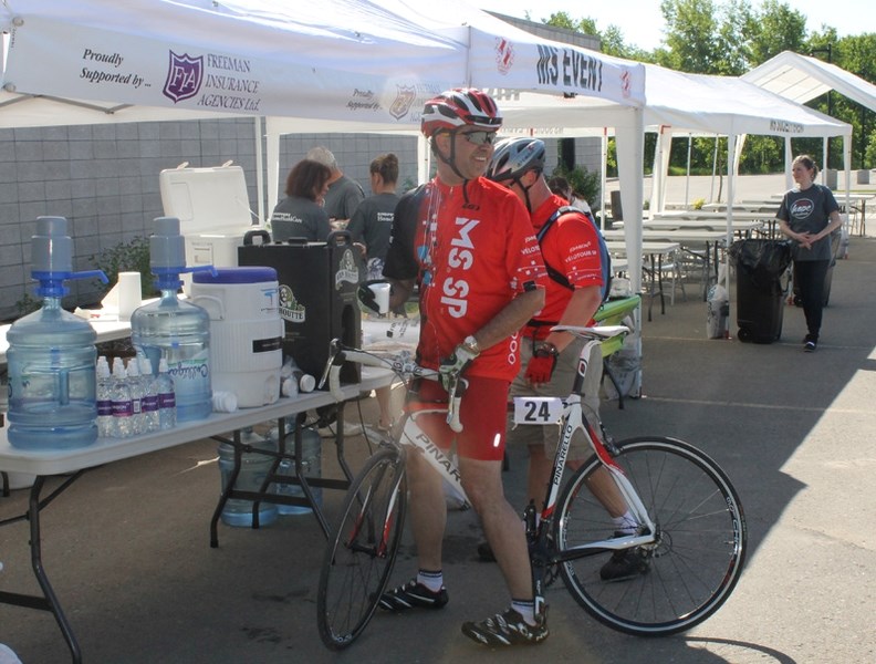 Red Deer lawyer Chris Richards arrives at the Innisfail Library Learning Centre at the head of the pack on June 8 during the 2014 Johnson MS Bike Tour.