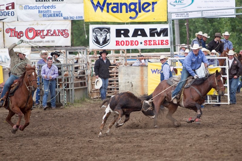 Cowboys compete in calf roping at the Innisfail Rodeo last year. This year&#8217;s event will be held June 12 to 15 at Daines Rodeo Ranch.