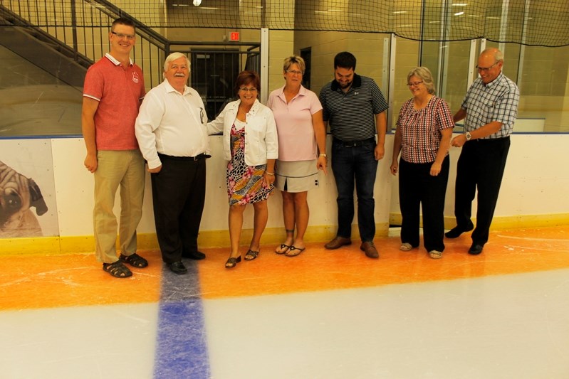 Penhold councillors look up and down at the Look-Up Line in the Penhold mulitplex. The mulitplex is possibly the only rink in Canada to have the safety feature installed.