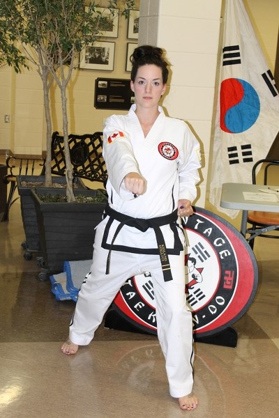 Keiland Stiglitz demonstrates a Tae Kwon-Do stance. Stiglitz is a 13-year student who is an assistant instructor with Advantage Tae Kwon-Do.