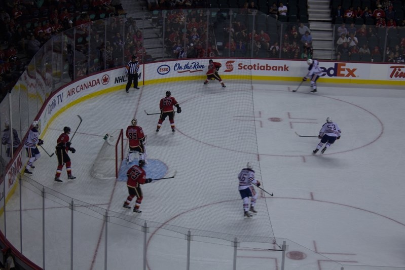 The Edmonton Oilers rush the Flames net in the third period in their 1-0 loss to the Calgary Flames at the Saddledome on Sept.21.