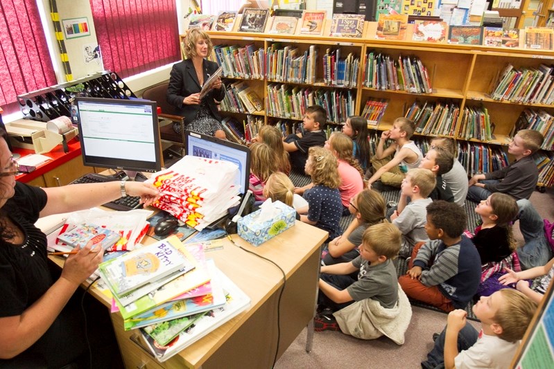 Noel West/MVP Staff&lt;br /&gt;Jessie Duncan Elementary School principal Trudy Henry reads to grade 2w students in the school&#8217;s library that has been moved into the