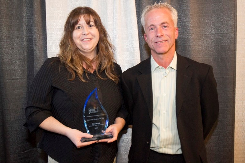 Kim Heck, a long time waitress at Mountain View Family Restaurant, was the winner of the Customer Service Award. The award was presented by Gary Smith, a chamber executive