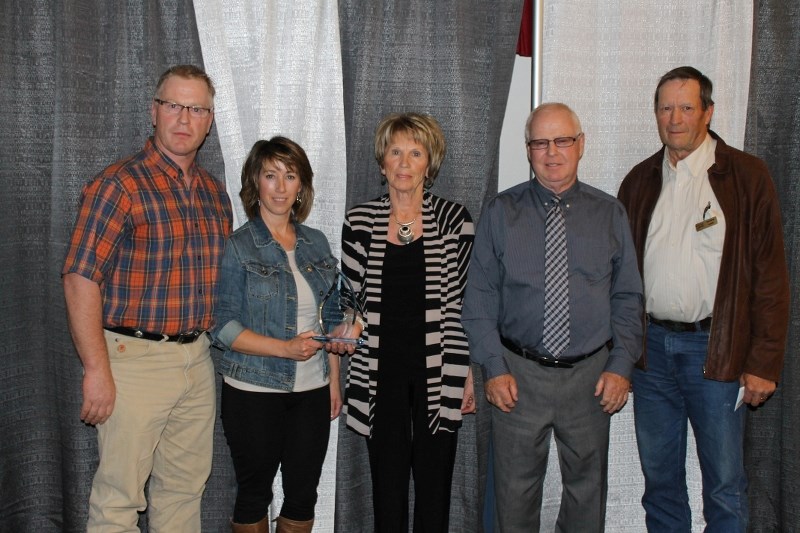 Diamond Four Farms was honoured with the Farm Family of the Year Award by Red Deer County Counc. Don Church (right).