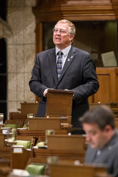 Red Deer MP Earl Dreeshen returned home from Ottawa on Oct. 24, and came to Innisfail the next day to lay a wreath at the cenotaph in honour of the two soldiers murdered in