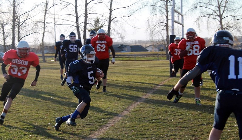 Ward Marshall (#5) rushes in the end zone for a touchdown during the Innisfail Cyclones&#8217; 64-27 victory over the Sundre Bisons.