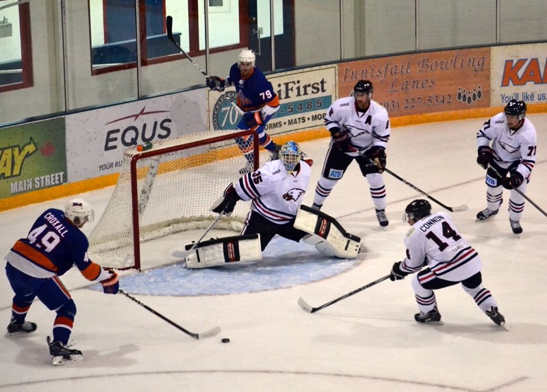 There was plenty of action around the Eagles&#8217; starting goalie Steven Stanford in the first period of the Oct. 24 game between Innisfail and the Okotoks Drillers. The