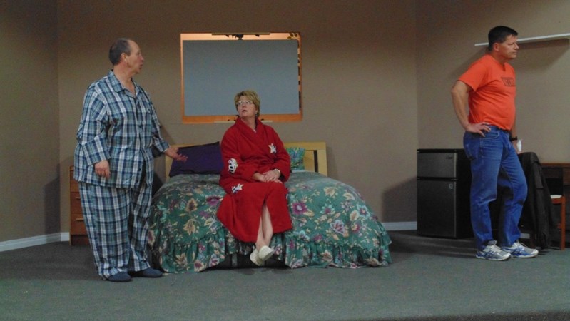 Actors Mark Kemball, Karlene Duffy and Ralph Trotske rehearse a scene from Innisfail Town Theatre&#8217;s upcoming production, Bedtime Stories by Norm Foster.