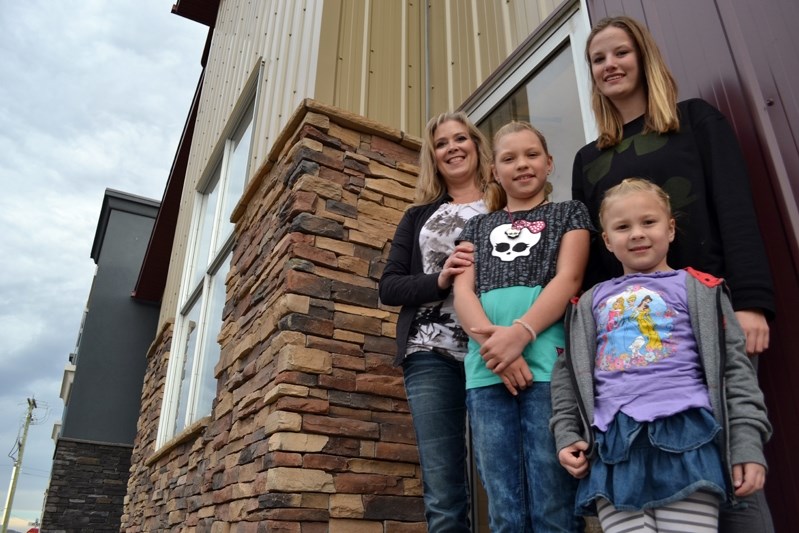 Joy McIlwain, owner of Joy&#8217;s School of Dance (far left), is joined by students Kiara Brack, Shelby Mackie and Ahriella Brack in front of their building at 4915 &#8211;