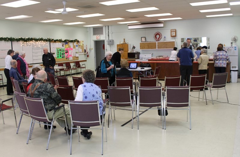 Seniors discuss issues after a wellness presentation earlier this year at the seniors drop- in centre.