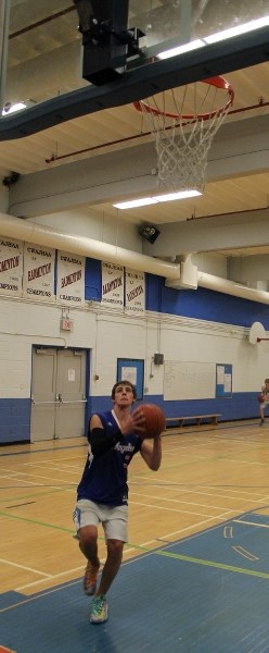 Jayden Halls goes in for a layup during Innisfail High School Cyclones tryouts.