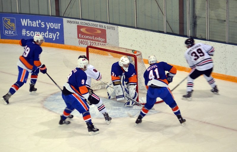 The Innisfail Eagles buzz around the Okotoks Drillers net during a spirited first period of action at home on Nov. 14. The game was tied 2-2 after the first period but the