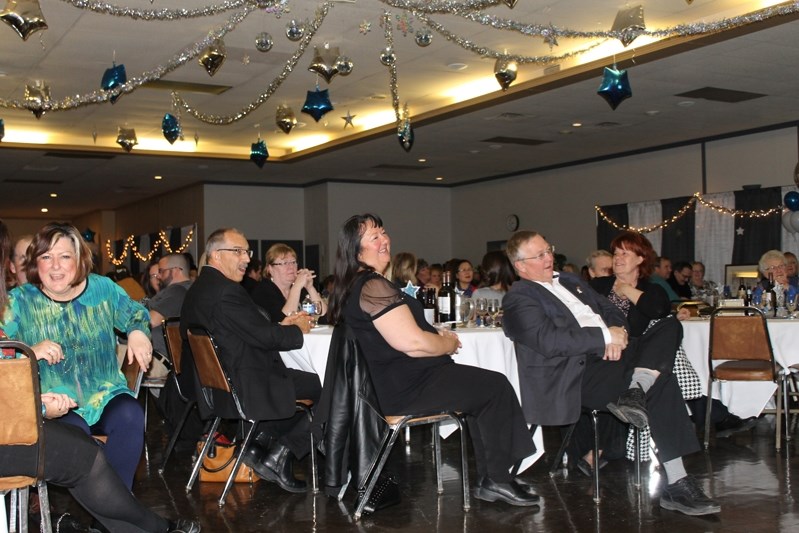 Red Deer MP Earl Dreeshen (centre right) and wife Judy (centre left) enjoy an evening of entertainment during Big Brothers Big Sisters of Innisfail Sparkle evening held on