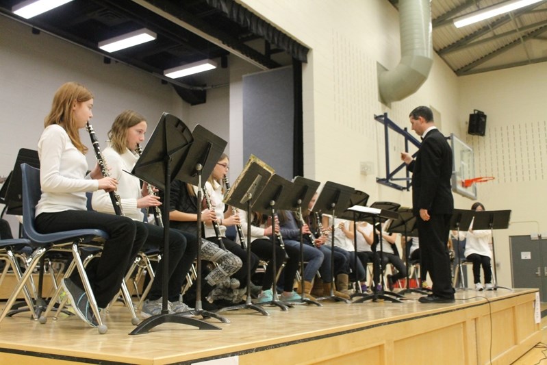 Innisfail Middle School band students conducted by Chris Bushel perform during their Dec. 4 band concert.