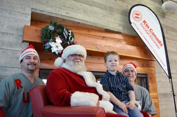 Three-year-old Owen Prestlien-Kerik with Santa Claus and his elves at the annual Kinsmen Breakfast with Santa event on Nov. 28.