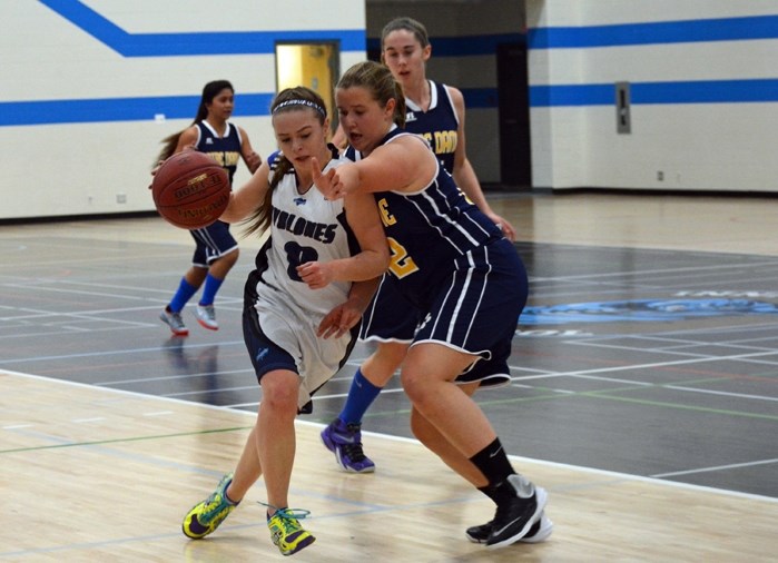 Members of the Innisfail High School senior girls basketball team are seen here in action against Notre Dame in their first game of the season last Tuesday.