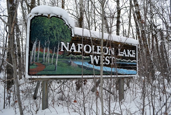 A sign for the planned Napoleon Lake West subdivision at its future site above the north and west sides of the lake. Construction of the new low- and high-density residential 