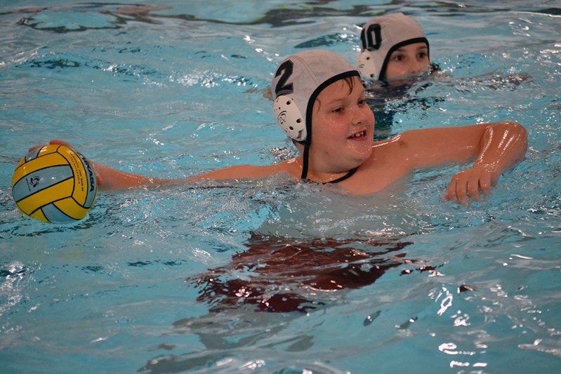 Aaron Bath-Yofonoff prepares to unload a shot during a game at a local clinic hosted on Jan. 30 by the Innisfail Hurricanes Water Polo Club.